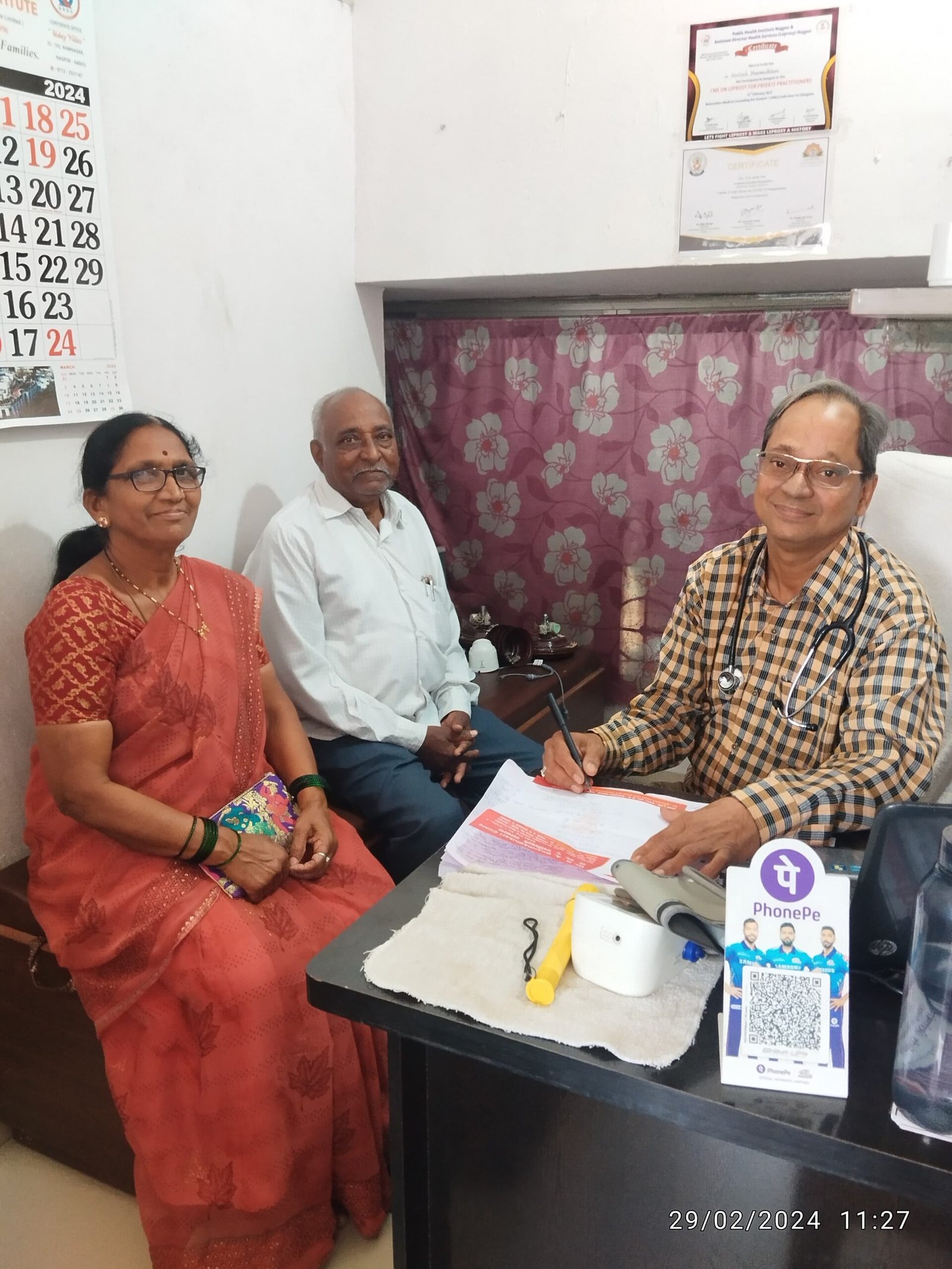 Senior citizen couple visiting Dr. N. A. Dharmadhikari for follow-up, expressing warmth and familial affection like a brother and brother-in-law
