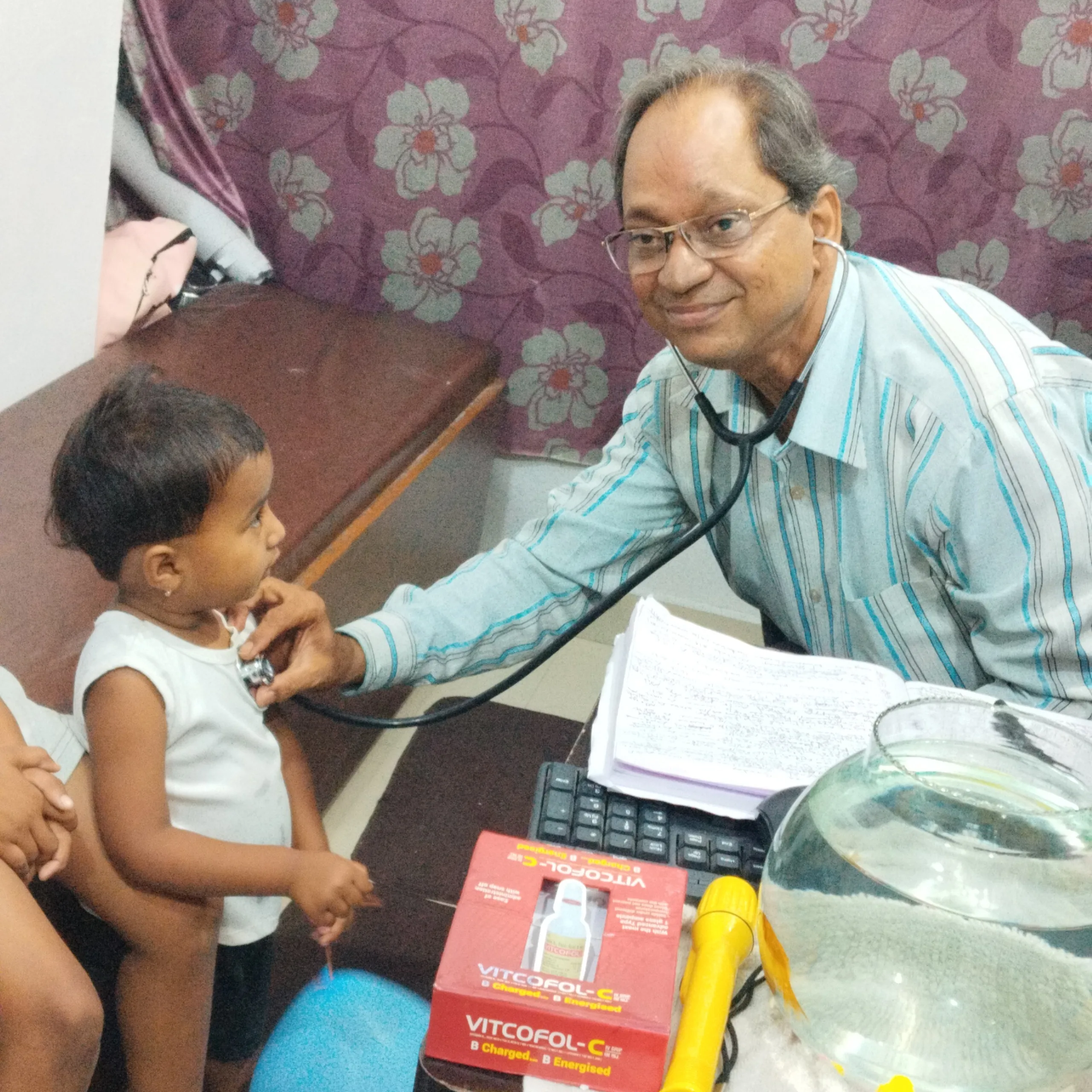 Young boy undergoing clinical chest examination.