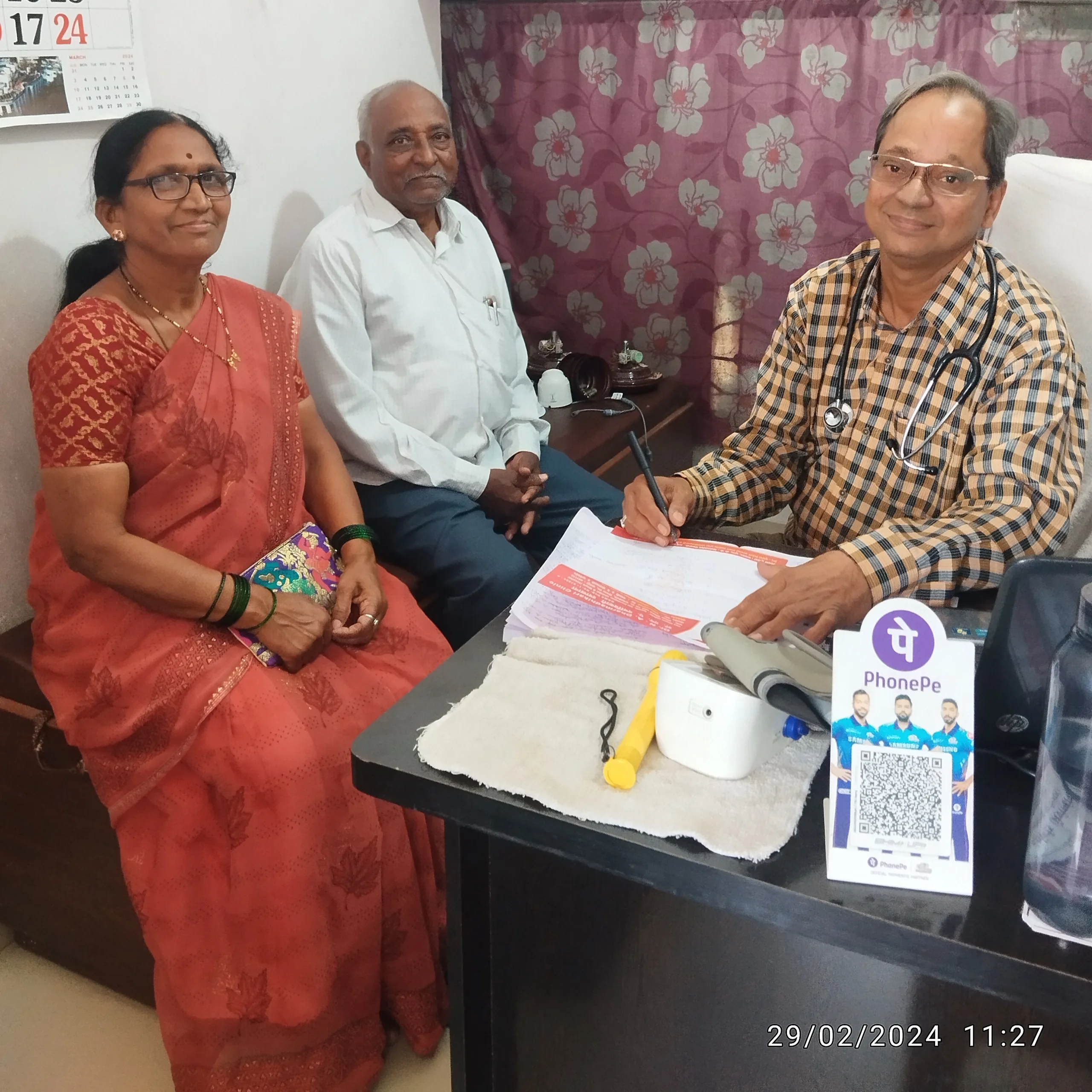 Senior citizens attending follow-up consultation for respiratory health.