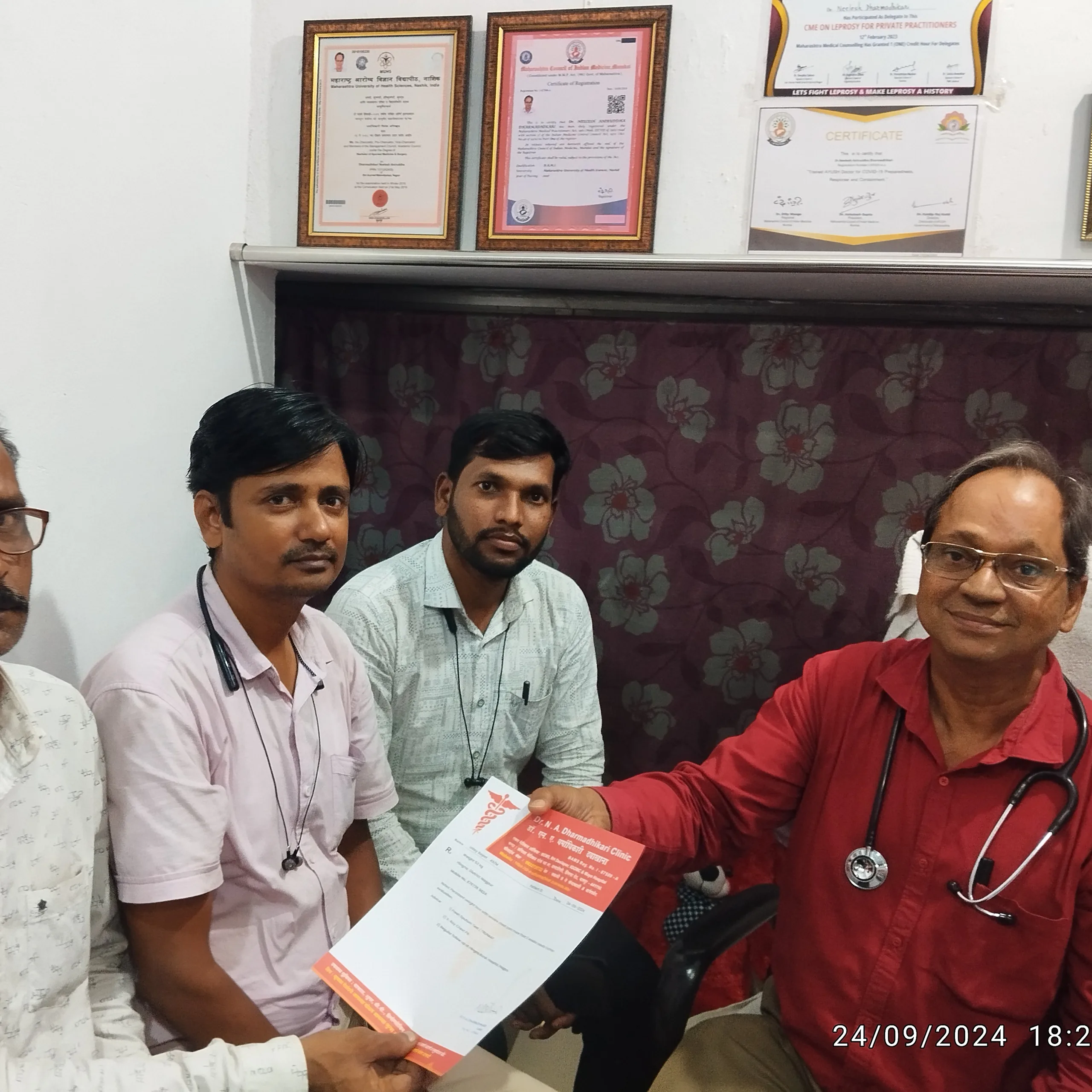 Public health team visiting Dr. N. A. Dharmadhikari Clinic for tuberculosis programme coordination.