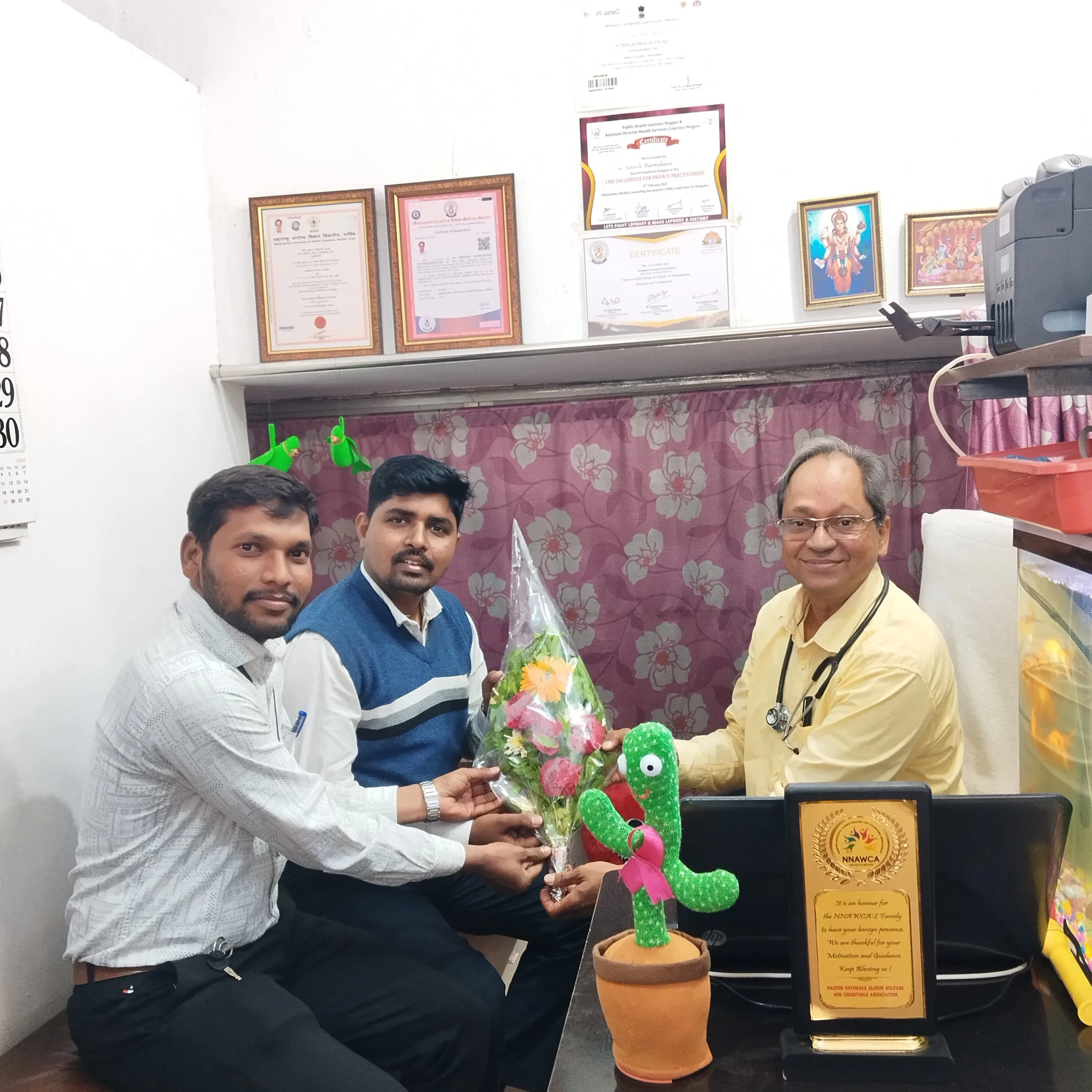 Healthcare professionals appreciating Dr. N. A. Dharmadhikari for tuberculosis care services.