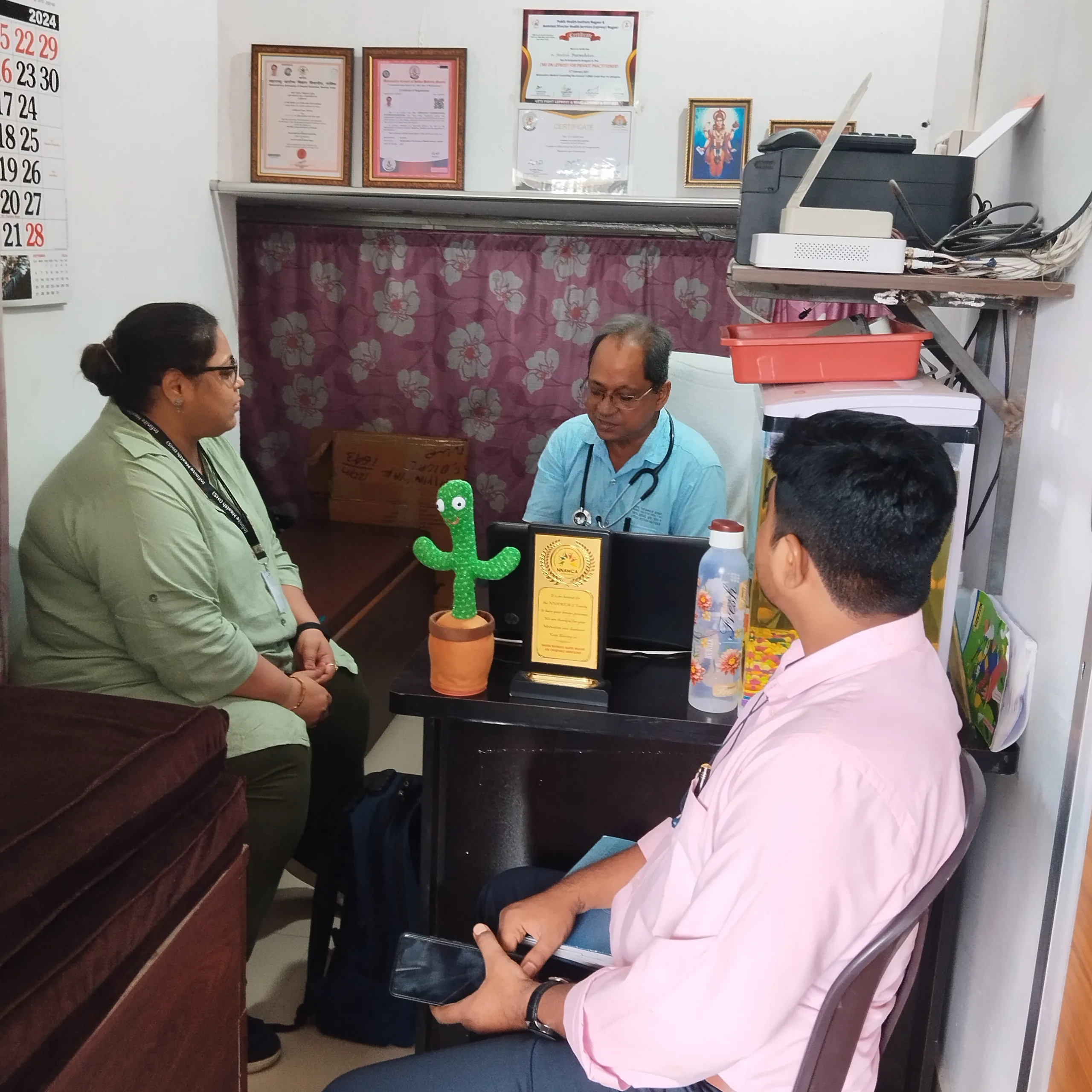 Public health professionals visiting Dr. N. A. Dharmadhikari Clinic for tuberculosis care collaboration.
