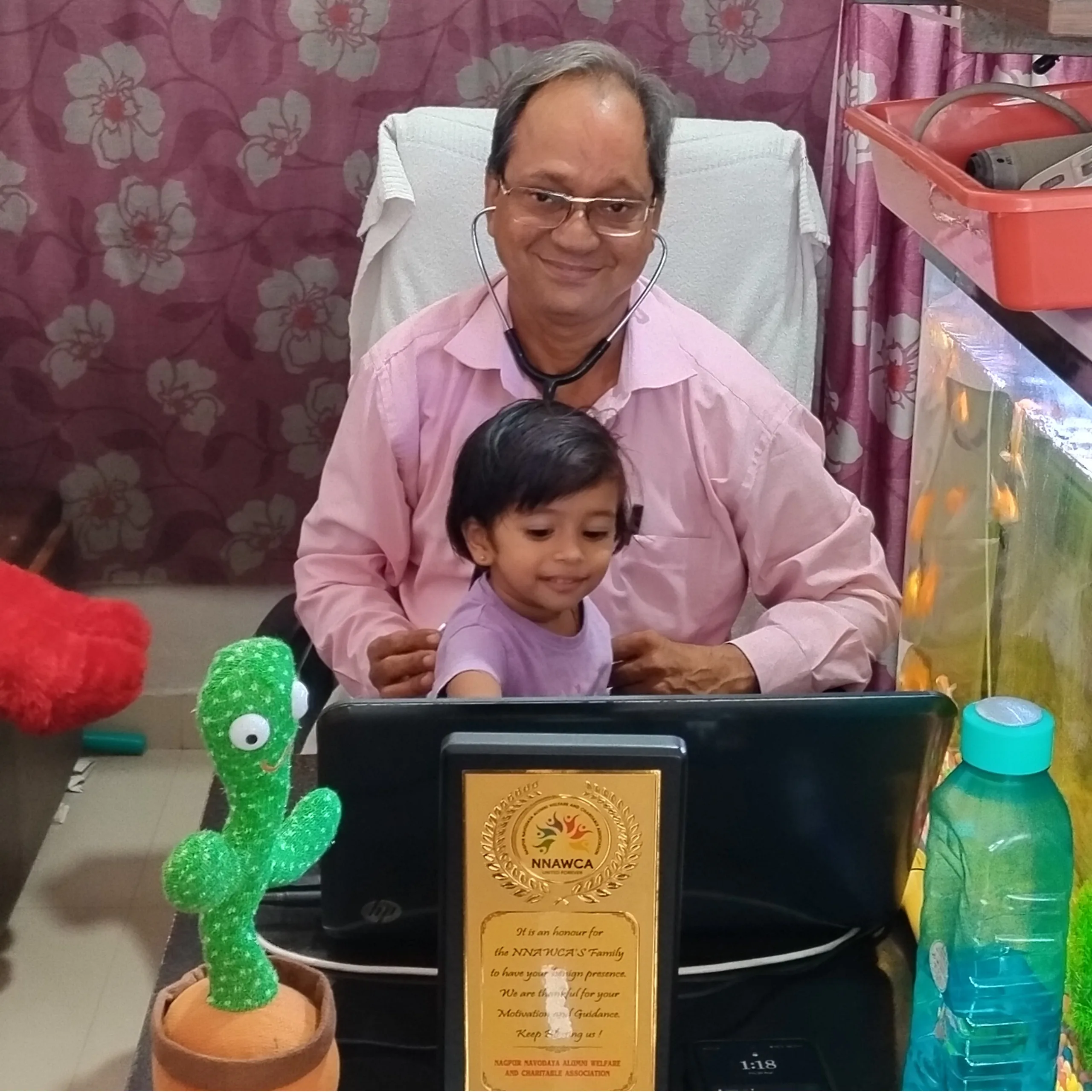 Young child comfortably examined using a stethoscope.